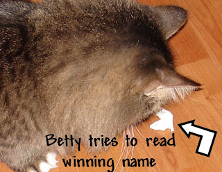 Betty-tries-to-read-winning-name-of-Blue-Starr-Gallery-free-drawing