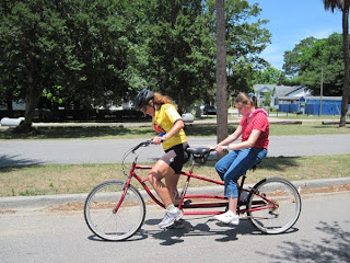 Shelby tandem biking with a sighted pilot