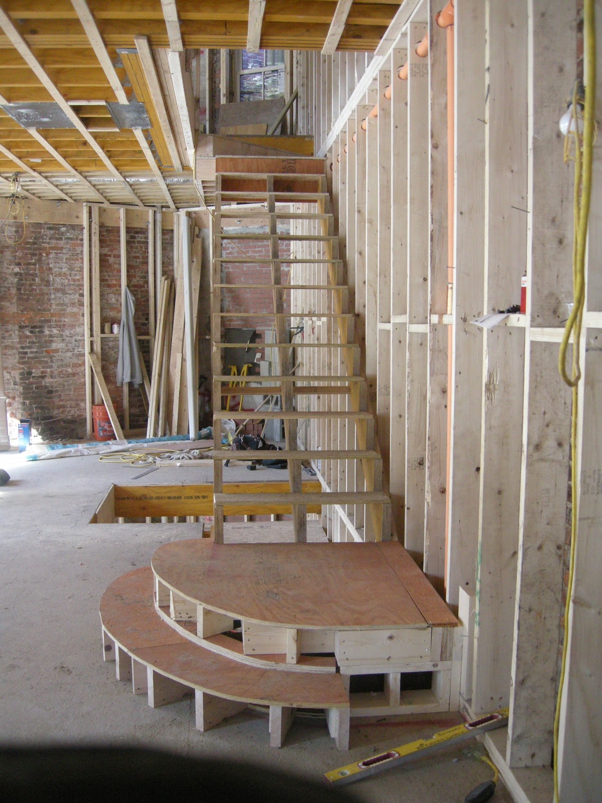 redbrickbuilding Staircase framing begins in our unit