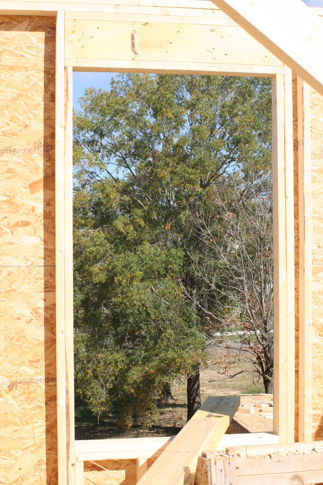 Our house.... Second floor framing mostly complete Window