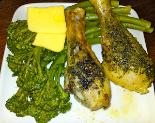 Roasted chicken drumsticks and boiled broccolini with butter