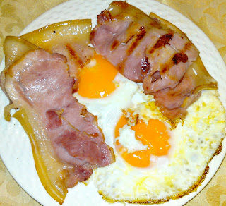 Fried eggs and grilled bacon