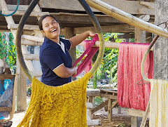 Hanging naturally dyed silk yarns to dry, Panmai Group, Northeast Thailand