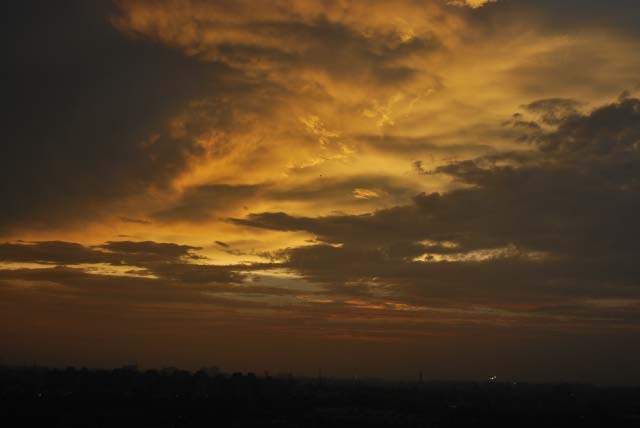 Sunset after heavy rains in Delhi - By Saurabh Gupta : Posted by VJ SHARMA at www.travellingcamera.com : Here are few photographs clicked by Saurabh Gupta from his Office terrace... (Noida)Its rare thing to have clear sky and get these colors during sunset... Normally there is lot of pollution and sky is not clear.. This time monsoons have flushed out all haziness from sky....Here is view of Sunset with Sector-21 apartments in the bottom...Its been more than one week we can clear and blue sky during day time... n these colors in the evening...Sunset color behind SPICE MALL in City Center of Noida....Colorful clouds look very angry and planning for showers during night...Another shot of the terrace during early time of the sunset...