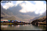 Mani Mahesh Yatra 2010 @ bharmaur, Chamba, Himachal Pradesh : by VISHAL SHARMA : Posted by Vishal Sharama @ www.travellingcamera.com : The Mani Mahesh lake is the venue of a highly revered pilgrimage trek undertaken during the month of August/September corresponding to the month of Bhadon according to Hindu calendar.. on the eighth day of the New Moon period. It is known as the ‘Manimahesh Yatra’. The Government of Himachal Pradesh has declared it as a state-level pilgrimage.... Manimahesh Lake (also known as Dal Lake, Manimahesh) is a high altitude lake (elevation 4,080 metres (13,390 ft)) situated close to the Manimahesh Kailash Peak in the Pir Panjal Range  of the Himalayas.. which is in the Bharmour subdivision of Chamba district of the Indian state of Himachal Pradesh. The religious significance of this lake is next to that of the Lake Manasarovar in Tibet...The lake, of glacial origin, is in the upper reaches of the Budhil River, a tributary of the Ravi River  in Himachal Pradesh. However, the lake is the source of a tributary of the Budhil River, known as ‘Manimahesh Ganga’. The stream originates from the lake in the form of a fall at Dhancho. The mountain peak is a snow clad tribal glen of Brahamur in the Chamba district originating as an off-shoot spur of the Pir Panjal Range. The highest peak is the Mani Mahesh Kailas, also called ‘Chamba Kailash' (elevation 18,546 feet (5,653 m)) overlooking the lake...Me on the way to Manimahesh Yatra from Bharmaur, Chamba, Himachal Pradesh, INDIA... I enjoyed the whole journey and would be sharing more photographs of amazing hills, Water-Falls later...At some spaces roads were very adventurous and it was a thrilling journey for me.... Road inside the dense forests of Himalyas... Pir Panjal Rage in Himachal Pradesh.... More adventurous journey was from Chamba to Bharmour... Just have a look at photograph above and imagine who deep it would have been.. and I am sure, you would not be able to imagine as deep as it was :-) ... I will be sharing more photographs of this place to give an exact idea about these roads... Love it !!!People who can't afford to trek through all the hills, can have Helicopter ride to Manimahesh... Asha Ram ji Bapu also visited Manimahesh Lake this year through Helisopter... Would be sharing more photographs of Helicopter ride soon...Here is a view of Sunrise @ Pir Panjal moutain ranges of Himalyas near Mani Mahesh Lake... check out this blog in next few days for more wonderful views around Mani Mahesh Lake...Note the trekking path in the bottom of this photograph and try to imagine the surrounding... Can you imagine it???According to one popular legend, it is believed that Lord Shiva created Manimahesh after he married Goddess Parvati, who is worshipped as Mata Girja. There are many legends narrated linking Lord Shiva and his show of displeasure through acts of avalanches and blizzards that occur in the region...