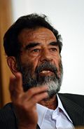 [120px-Saddam_Hussein_at_trial,_July_2004.JPEG]