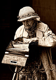 Elderly lady searching handbag