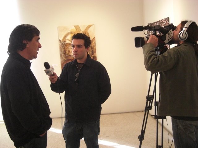 The Artist and curator of the exhibition Francisco Urbano giving an interview to TV