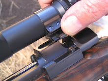 Push-button quick-release low scope mounting system is machined into Mauser-type receiver.
