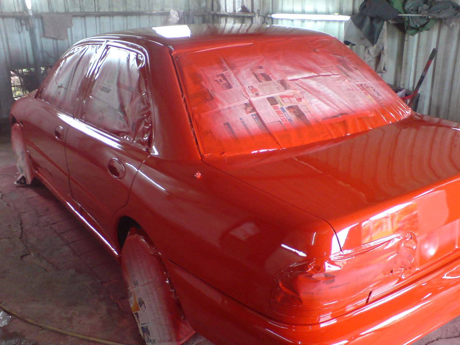 proton wira cat luar..merah berkilat