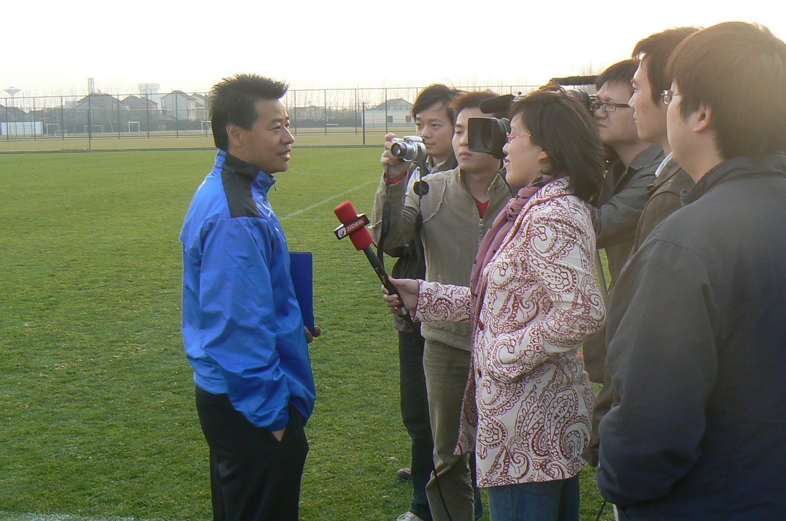 Wu Jingui talking to reporters at Shanghai Shenhua's training ground