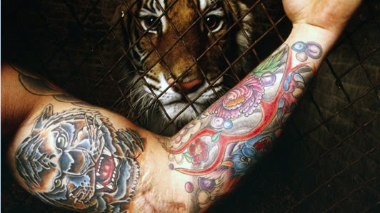 Tiger arm tattoo on bicep