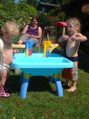 My Beautiful Family: The kids playing outside in the water!