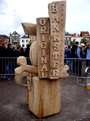 wood sculpture that says original bankster on it