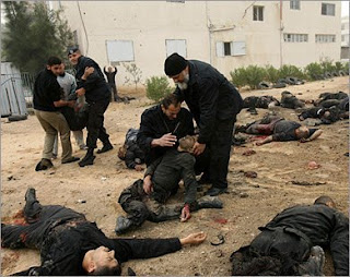 Palestinians aiding the wounded, surrounded by corpses