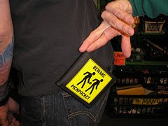 clowning around with a wallet with a pickpocketing warning on it