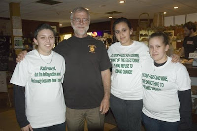 Howie Hawkins standing with supporters