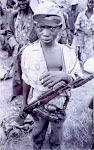 A child forced to participate in war.