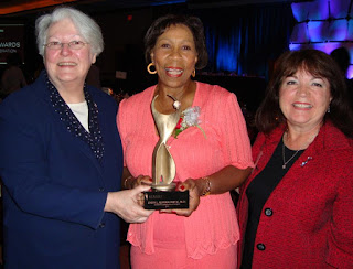 Norma Rist Past Chair of ATHENA International stands with Daisy Alford-Smith Executive Director of the Girl Scouts of North East Ohio and the Akron area 2010 ATHENA International Leadership Award Recepient and Dianne Dinkel ATHENA International President CEO