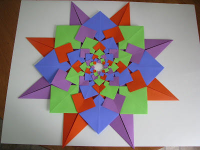 Tomoko Fuse's Origami Quilt Blooming Flowers 1 in Orange, Green, Blue, and Purple