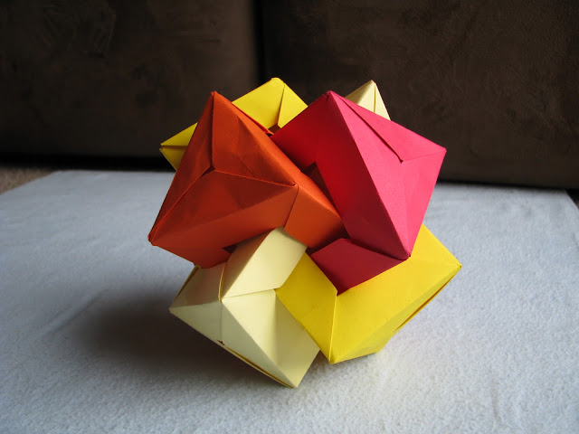 Daniel Kwan Four Interlocking Triangular Prisms Red to Yellow