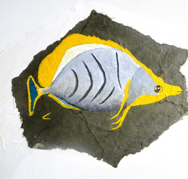 le poisson papillon à tête jaune