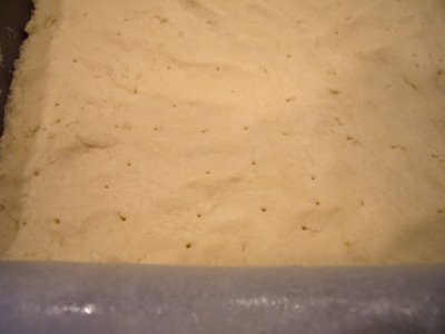 [dough_with_holes_in_pan.JPG]