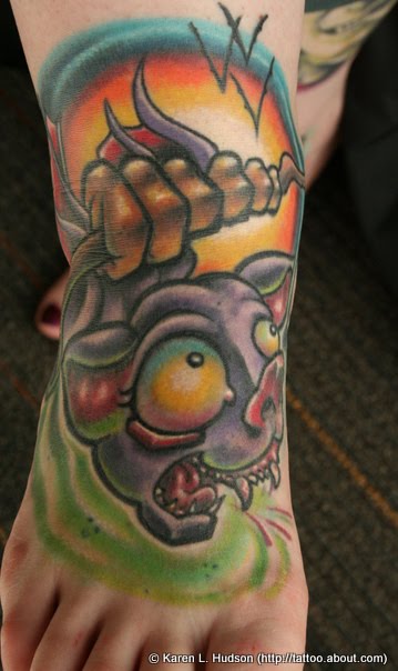 Bat face with horned skulll chest and stomach tattoo. Animated Bat Tattoo on Foot
