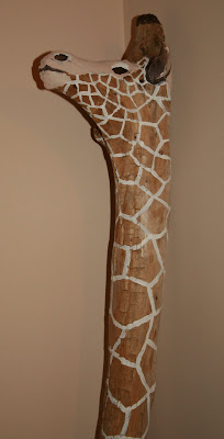 Painted giraffe driftwood