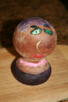 Painted fence knob lady