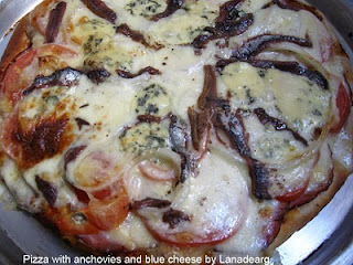 Pizza with anchovies and blue cheese.