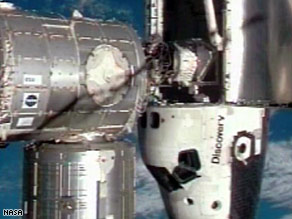 [discovery-shuttle-docks.jpg]