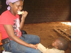 Eating with One of Our Villages Youngest Neighbors A Pygmy Baby