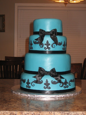 Teal Wedding Cakes With Ribbon Lilies White Rose Flowers and Acecories