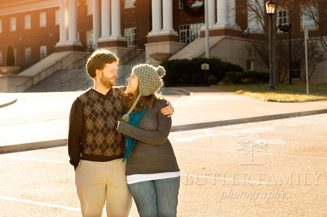 Medium shot of couple giving a squeeze looking at each other