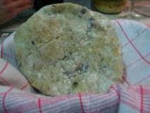 Home-made pita bread with olives Greta style