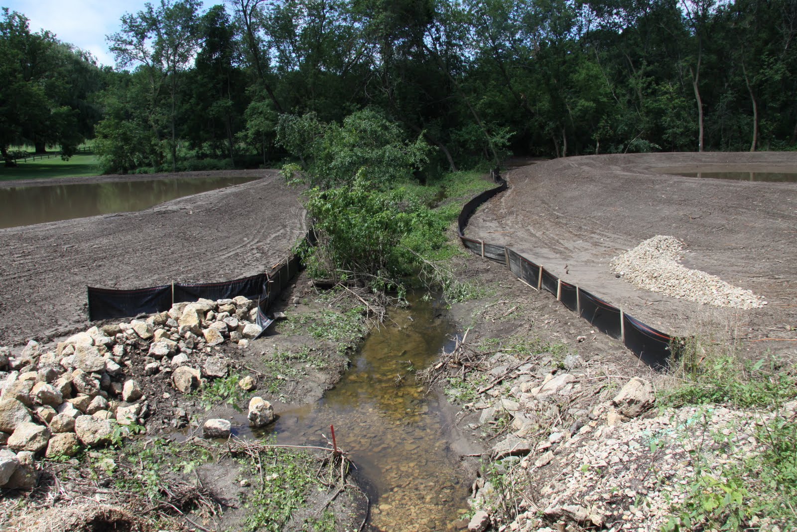 The Contractor Report: Sediment pond under construction at risk during ...