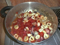 Add tomatos and tortellini