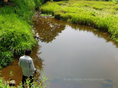 man standing near gauripada lake