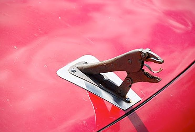 Just A Car Guy hood ornaments