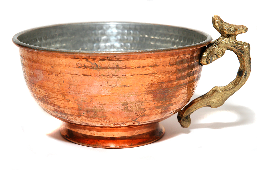 The Beauty of Good Health Ayurveda Drink from a Copper Cup.