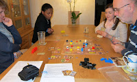 Players midway through a game of Patrician
