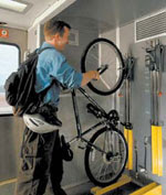 Image of bicyclist racking bike on Amtrak Capitol Corridor in California