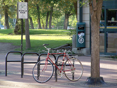 Image of a bicycle parked near an Edmonton transit stop