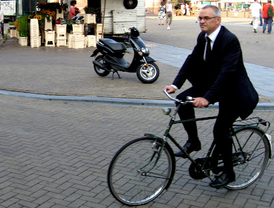 Image of bicyclist in a suit