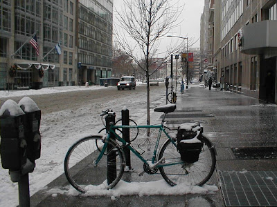 Image of parked bicycle on snowy street