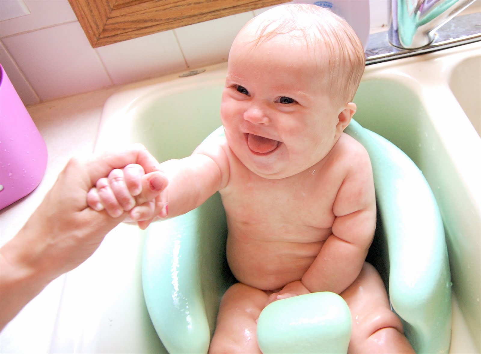 The Harnisch Family Baby Bathing in the Bumbo!