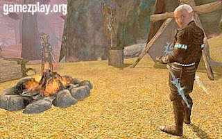 screenshot with sword carrying man standing beside fire in forest clearing