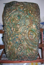 Plaster cast painted in layers, rubbing back into paint each time.