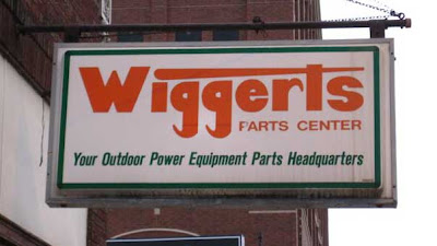 Wiggerts Parts Center sign. The right side of the P in Parts has been scratched off so it looks like an F